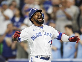 Teoscar Hernandez celebrates his two-run home run in the eighth inning against the Phillies on Wednesday night at the Rogers Centre. It was his second blast of the night.