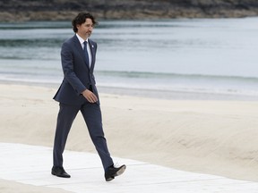 Canada's Prime Minister Justin Trudeau arrives for the G7 meeting at the Carbis Bay Hotel in Carbis Bay, St. Ives, Cornwall, England, Friday, June 11, 2021. Leaders of the G7 begin their first of three days of meetings on Friday, in which they will discuss COVID-19, climate, foreign policy and the economy. (Phil Noble, Pool via AP)