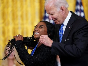 U.S. President Joe Biden awards the Presidential Medal of Freedom to U.S. Olympic gymnast Simone Biles during a ceremony in the East Room at the White House in Washington, U.S., July 7, 2022.