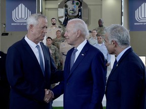 Israeli Prime Minister Yair Lapid and U.S. President Joe Biden attend a briefing on the Israel's Iron Dome and Iron Beam Air Defense Systems at the Ben Gurion International Airport in Lod, near Tel Aviv, Israel, July 13, 2022.