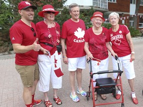 The 65th annual East York Canada Day parade  (Pictured, L-R) East York-Beaches city councillor Brad Bradford, Sandra Collins, of Hendriks Court seniors residence mayor John Tory, Lee Atkinson and Marilyn Hickling are happy the parade has returned. Back in 2020 Collins and seven of her friends were the only ones celebrating Canada on Woodbine Ave. as everything was cancelled on Friday July 1, 2022. Jack Boland/Toronto Sun