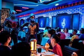 Ant-Man and the Wasp greet diners inside the Worlds of Marvel aboard the Disney Wish.