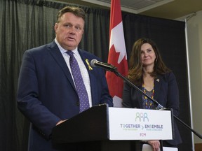 Halifax Mayor Mike Savage, left, speaks while Regina Mayor Sandra Masters, looks on at a Federation of Canadian Municipalities press conference at Queensbury Convention Centre. The FCM meets from June 3-5, to discuss housing affordability and economic recovery.