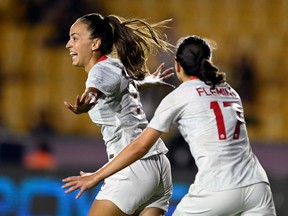 Canada's Julia Grosso (L) celebrates after scoring against Panama during their 2022 Concacaf Women's Championship football match, at the Universitario stadium in Monterrey, Nuevo Leon State, Mexico on July 8, 2022.