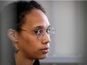 US WNBA basketball superstar Brittney Griner sits inside a defendants' cage before a hearing at the Khimki Court, outside Moscow on July 27, 2022. 