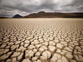 Clouds gather but produce no rain as cracks are seen in the dried up municipal dam in drought-stricken Graaff-Reinet, South Africa, November 14, 2019.