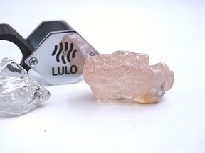 This photo supplied by Lucapa Diamond Company on Wednesday, July 27, 2022, shows the 170 carat pink diamond, right, recovered from Lulo, Angola.