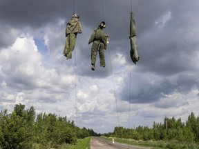 Dummies depicting Russian soldiers are seen hanging near the frontline in the Kharkiv region, Ukraine, Saturday, July 23, 2022.