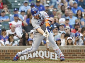 Jul 17, 2022; Chicago, Illinois, USA; New York Mets first baseman Pete Alonso (20) singles against the Chicago Cubs during the fifth inning at Wrigley Field.