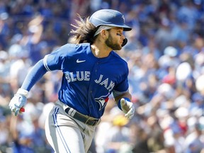 Jul 10, 2022; Seattle, Washington, USA; Toronto Blue Jays shortstop Bo Bichette (11) watches his solo-home run against the Seattle Mariners during the seventh inning at T-Mobile Park.