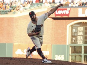 San Francisco Giants starting pitcher Carlos Rodon pitches a third strike-out in a row with the bases loaded against the the Milwaukee Brewers during the second inning at Oracle Park.