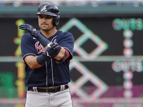 Jul 16, 2022; Washington, District of Columbia, USA; Atlanta Braves third baseman Austin Riley (27) gestures towards his dugout after hitting a double against the Washington Nationals during the first inning at Nationals Park.