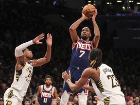 Apr 10, 2022; Brooklyn, New York, USA;  Brooklyn Nets forward Kevin Durant (7) takes a three point shot in the fourth quarter against the Indiana Pacers at Barclays Center.