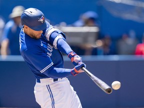 Toronto Blue Jays centre fielder George Springer hits a double against the Tampa Bay Rays at Rogers Centre.