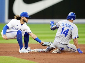 Bo Bichette of the Toronto Blue Jays tags out Edward Olivares of the Kansas City Royals during their MLB game at the Rogers Centre on July 14, 2022 in Toronto.