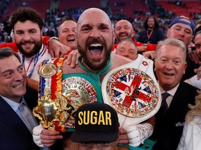 Boxing - Tyson Fury v Dillian Whyte - WBC World Heavyweight Title - Wembley Stadium, London, Britain - April 23, 2022 

Tyson Fury celebrates after winning his fight against Dillian Whyte