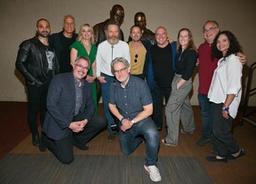 (Front, left to right) “Breaking Bad” series creator Vince Gilligan, producer Peter Gould, (back row, left to right) actor Michael Mando, actor Patrick Fabian, actress Rhea Seehorn, actor Bryan Cranston, actor Aaron Paul, actor Dean Norris, executive producer Melissa Bernstein, writer/director Thomas Schnauz and supervising producer Trina Siopy pose during an unveiling ceremony of bronze statues depicting television characters Walter White, played by Cranston, and Jesse Pinkman, played by Paul at the Albuquerque Convention Center on July 29, 2022 in Albuquerque.