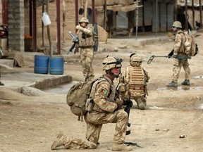 A file photo taken on February 25, 2010 shows British soldiers on patrol in the streets of Showal in Nad-e-Ali district, Southern Afghanistan.
