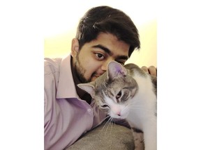 Abbas Zoeb pets one of his cats, Mimi. (Abbas Zoeb photo)