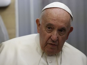 Pope Francis speaks to journalists aboard the flight back from Canada Saturday, July 30, 2022, where he paid a six-day pastoral visit.