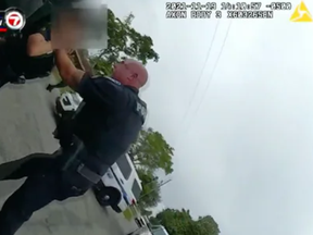 Sgt. Christopher Pullease, with the Sunrise Police Department in Florida, has been charged with assault, battery and tampering with evidence after video showed him grabbing a fellow officer by the throat.