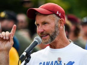 Army reservist James Topp speaks to the crowd during a protest against COVID-19 health measures at the National War Memorial in Ottawa, Thursday, June 30, 2022.