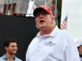 Former president Donald Trump walks off the first tee box during the first round of a LIV Golf tournament at Trump National Golf Club Bedminster, N.J., July 29, 2022.