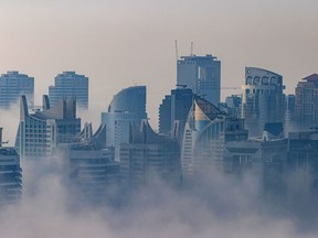 Morning fog shrouds residential and commercial skyscrapers in the Dubai Marina district of Dubai, United Arab Emirates, on Sunday, Jan. 17, 2021.