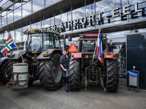 Farmers block the arrival and departure halls at Groningen Airport Eelde in Eelde, the Netherlands, to protest against the Dutch government's far-reaching plans to cut nitrogen emissions on July 6, 2022. - The Netherlands, the world's second-largest agricultural exporter, is one of the top greenhouse gas emitters in Europe -- especially of nitrogen -- with much of this blamed on cattle-produced manure and fertiliser. (Photo by Kees van de Veen / ANP / AFP) / Netherlands OUT (Photo by KEES VAN DE VEEN/ANP/AFP via Getty Images)