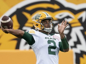 Edmonton Elks quarterback Tre Ford (2) throws during warm up prior to CFL football game action against the Hamilton Tiger Cats in Hamilton, Ont., Friday, July 1, 2022.