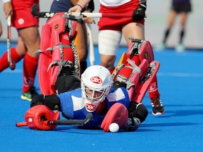 Canada goalie Marcia Laplante dives for the ball during Women's World Cup field hockey action against Argentina, in Terrassa, Spain, in a July 7, 2022, handout photo.