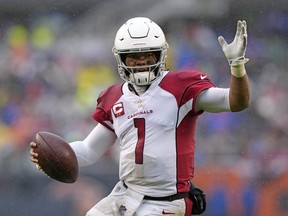 Dec 5, 2021; Chicago, Illinois, USA; Arizona Cardinals quarterback Kyler Murray (1) rushes for a touchdown against the Chicago Bears during the first quarter at Soldier Field. Mandatory Credit: Mike Dinovo-USA TODAY Sports