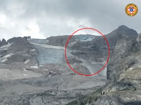 A handout photo from Alpine rescue services shows where an ice glacier collapsed on Marmolada mountain, Italy, July 3, 2022.