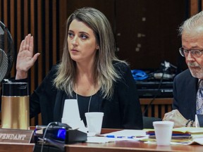 Kate McClure, 29, with her lawyer Jim Gerrow Jr., in State Superior Court, Burlington County Courthouse, Mt. Holly, N.J., April 15, 2019.