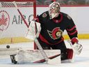 Feb 10, 2022; Ottawa, Ontario, CAN; Ottawa Senators goalie Matt Murray (30) watches the puck get past him on a shot from Pittsburgh Penguins  center Jeff Carter (77-not pictured) in the second period at the Canadian Tire Centre.  