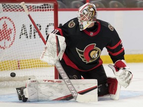 Feb 10, 2022; Ottawa, Ontario, CAN; Ottawa Senators goalie Matt Murray (30) watches the puck get past him on a shot from Pittsburgh Penguins  center Jeff Carter (77-not pictured) in the second period at the Canadian Tire Centre.