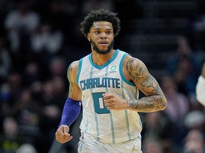 Charlotte Hornets forward Miles Bridges runs up court during an NBA game against the Denver Nuggets on Monday, March 28, 2022, in Charlotte, N.C.