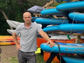 Julian Ganton, owner of Toronto Island SUP, has seen his paddleboarding business pick up this summer after two years of pandemic shutdowns.