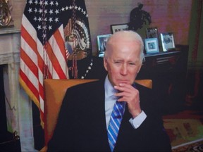 U.S. President Joe Biden, isolating following his COVID-19 diagnosis, appears virtually in a meeting with business and labour leaders about the Chips Act in an auditorium on the White House campus in Washington, July 25, 2022.