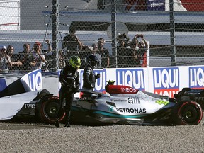 Mercedes' Lewis Hamilton walks away from his car after crashing during qualifying for the Austrian Grand Prix Friday at the Red Bull Ring in Spielberg, Austria.