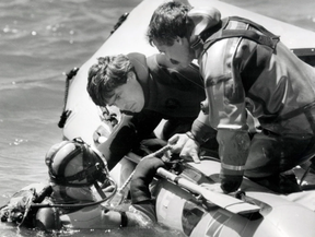 GRIM WORK: Police divers search the St. Lawrence River for the bodies of five Hells Angels. MONTREAL GAZETTE/ POSTMEDIA