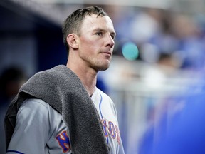 New York Mets starting pitcher Chris Bassitt looks out from the dugout during a game against the Miami Marlins, Saturday, June 25, 2022, in Miami.