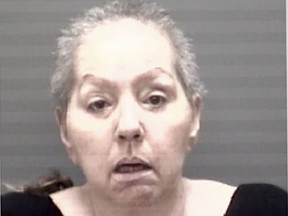 This photo provided by the Eaton County Sheriff's Office shows Beverly McCallum, who is accused in the 2002 fatal bludgeoning of her husband in Michigan, and has been ordered held on a $10 million bond following her return to the U.S. from Italy.