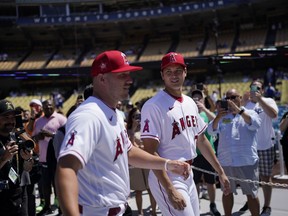 Los Angeles Angels' Mike Trout, left, and Shohei Ohtani enter the field during batting practice a day before the 2022 MLB All-Star baseball game, Monday, July 18, 2022, in Los Angeles.