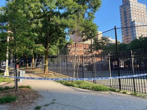 Crime scene tape surrounds the area on New York's Upper East Side, Thursday, June 30, 2022, where police say a 20-year-old woman was fatally shot Wednesday night while she pushed her infant daughter in a stroller.