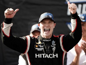 IndyCar driver Josef Newgarden celebrates after winning the NTT Indycar Series Championship during the WeatherTech Raceway Laguna Seca.