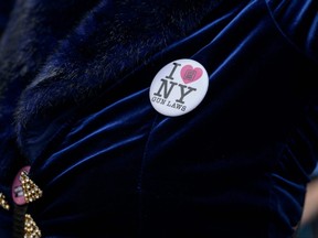 A protester wears a button reading "I Heart NY Gun Laws" during a protest against gun violence by the activist group "Gays against Guns" in New York City on June 23, 2022.
