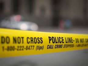 Police tape is shown in Toronto.