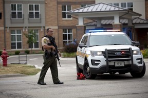 First responders work the scene of a shooting at a Fourth of July parade in Highland Park, Ill., Monday, July 4, 2022.