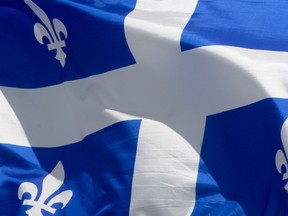 Quebec's provincial flag flies on a flag pole in Ottawa on June 30, 2020.